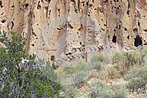 Reconstructed pueblo on cliffs at Bandelier National Monument, New Mexico photo