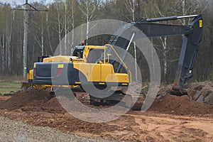 Reconstruction of the highway - yellow excavator at work