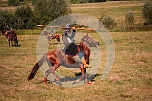 Reconstruction. Medieval armored knight with lance on horse from fantasy. Equestrian soldier in historical costume