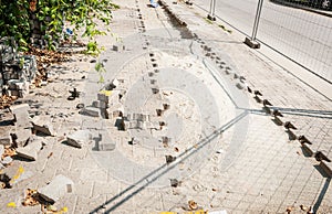 Reconstruction of the paving stones on the parking lot in the urban city street