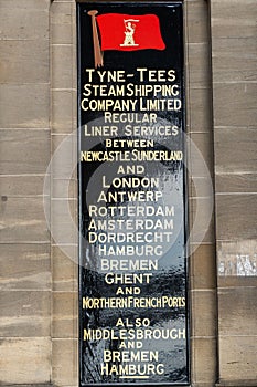 Reconstruction of a sign on a building on the Quayside, Newcastle upon Tyne, UK, showing city trade