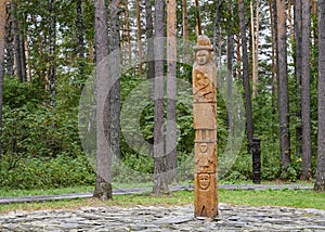 Reconstruction of Zbruch Idol symbolizing the thee-part structure of the universe in the forest in Siberia, Russia