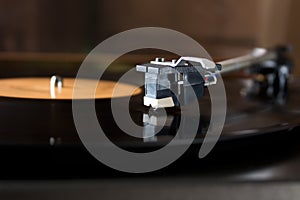 Record player stylus on a rotating disc