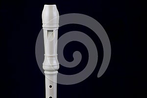 Recorder Wind Instrument Isolated on a Blue Background