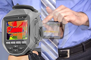 Recording Businessman With Thermal Camera