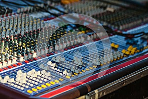 Recording console. A sound engineer`s mixing desk at a music festival