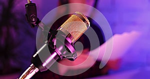 Recording podcast - podcaster radio station host working in studio. microphone closeup