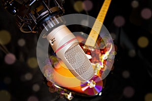Recording studio microphone over electric guitar