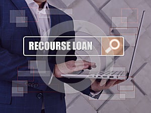 RECOURSE LOAN text in search line. Businessman looking for something at computer