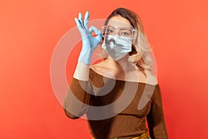 Recovery, excellent treatment for contagious disease. Woman wearing hygienic mask, gloves, protective glasses