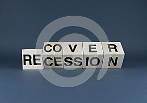 Recovery or recession. The cubes form the words Recover or Recession