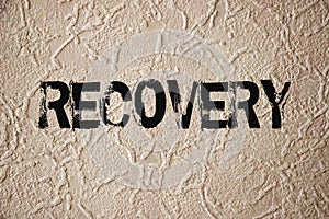 Recovery sign on grunge wall. Addictions or crisis rehabiliation concept photo