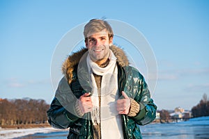 Recreation concept. Active leisure. Handsome man traveling in winter. Warm clothes for cold season. Winter fashion
