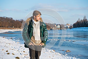 Recreation concept. Active leisure. Man traveling in winter. Warm clothes for cold season. Winter fashion. Winter