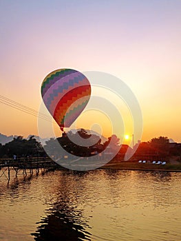 Recreation. Hot air balloon flying over the river