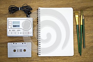 Recreation set top view with blank paper and cassette player