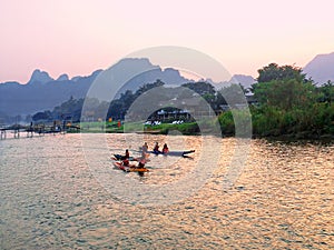 Recreation.Tourist kayaking and tubing along the river