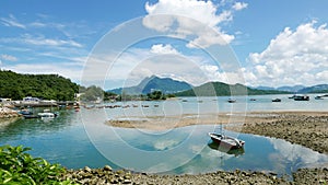 Recreational fishing Boat, lake, white cloud and blue sky