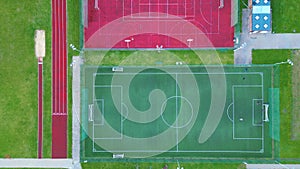 Recreational green grass active sports hockey and football fields overhead top down view. Competition court active outdoor people