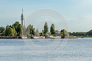 Recreational lake Mooie Nel in Spaarnwoude with a view on telecommunication tower