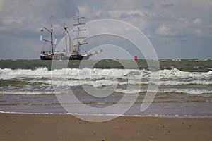 .Recreational sailors Three masted sailors sail on the North Sea close to the coast
