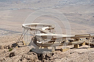 Recreational slide down mountain overlooking Al Ain City in United Arab Emirates below. Top of Jebal Hafeet