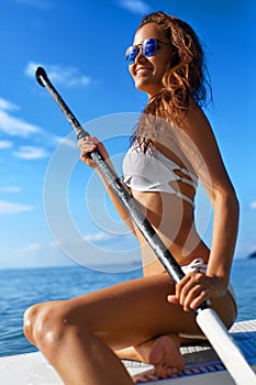 Recreational Sports. Woman Stand Up Paddle Boarding ( Surfing ).