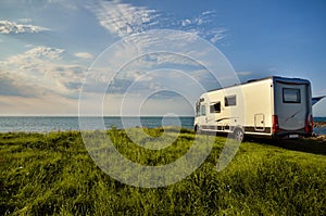 Recreational vehicle in a meadow photo