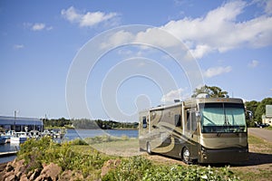 Recreational vehicle parked at harbour photo