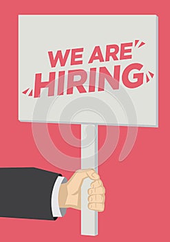 Recruitment shoutout with a placard banner against a red background. Concept of  job vacancy, corporate recruitment or career photo