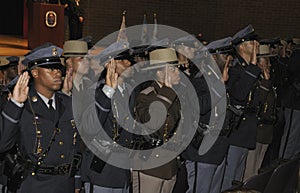 Recruits getting sworn in during a hraduation ceremony