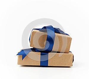 Rectangle box wrapped in brown kraft paper and tied with a silk blue ribbon