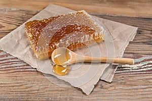 Rectangle Honey Comb and Wooden Spoon of Honey