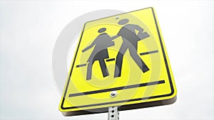 rectangle pedestrian school zone crossing sign, black print on yellow background,.