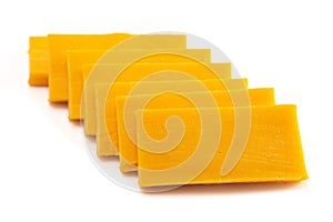 Rectangle Slices of Sharp Cheddar Cheese on a White Background