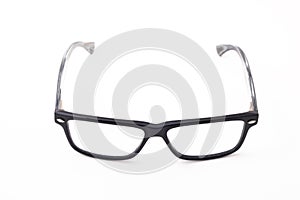 Rectangular black-rimmed glasses are located frontally on a white background.