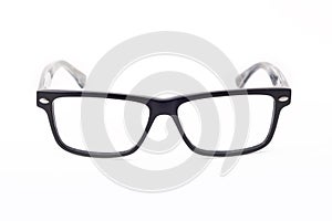 Rectangular black-rimmed glasses are located frontally on a white background