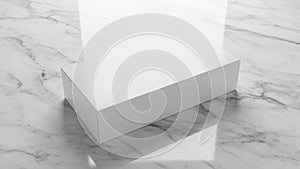 Rectangular block on a smooth reflective marble surface featuring