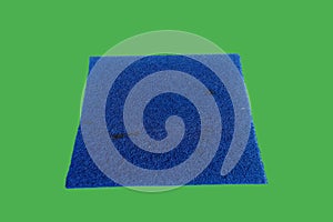 A rectangular blue plastic mat with a rough texture, used for cleaning feet.