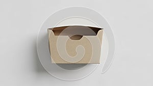 Rectangular cardboard box with an open end and cutout notch for easy access