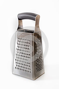 Rectangular, cone-shaped grater for vegetables on a white background