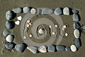 Beach stone frame with word Love on the sand