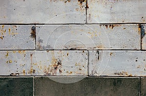 Rectangular glazed tile background with rust effect