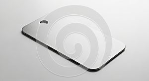 A rectangular metallic object with rounded