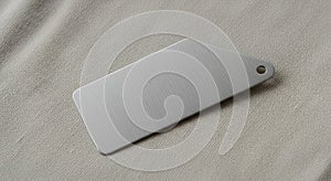 Rectangular metallic tag with a brushed