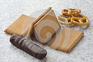 Rectangular shortbread cookies and chocolates on a light marble top