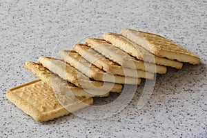 Rectangular shortbread cookies on a light marble top. Homemade baking