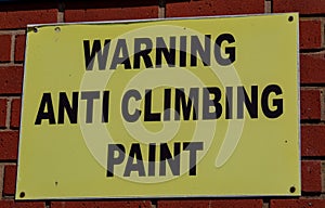 Rectangular sign warning of anti climbing paint Widnes April 2019