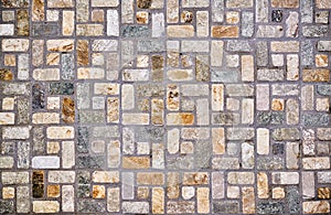 colored rectangular stones on the ground making shapes and giving texture photo