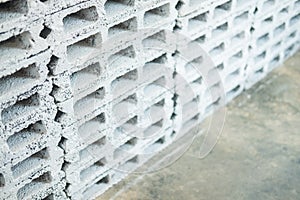 Rectangular thick concrete blocks are characterized by small pores scattered throughout the cube